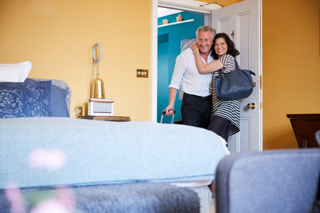 Middle Aged Couple Hugging in a Hotel Room
